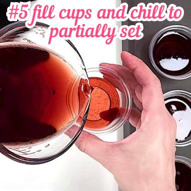 Filling jello shot cups.