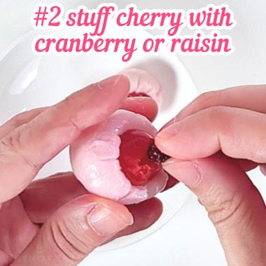 Stuffing cherry with dried cranberry.