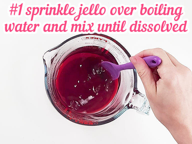 Sprinkling cherry jello over boiling water.
