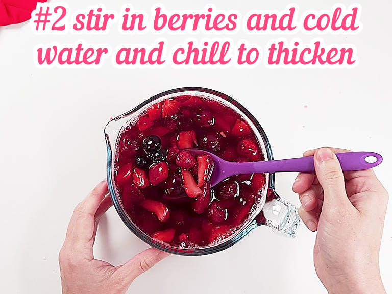 Stirring frozen cherries in jello.