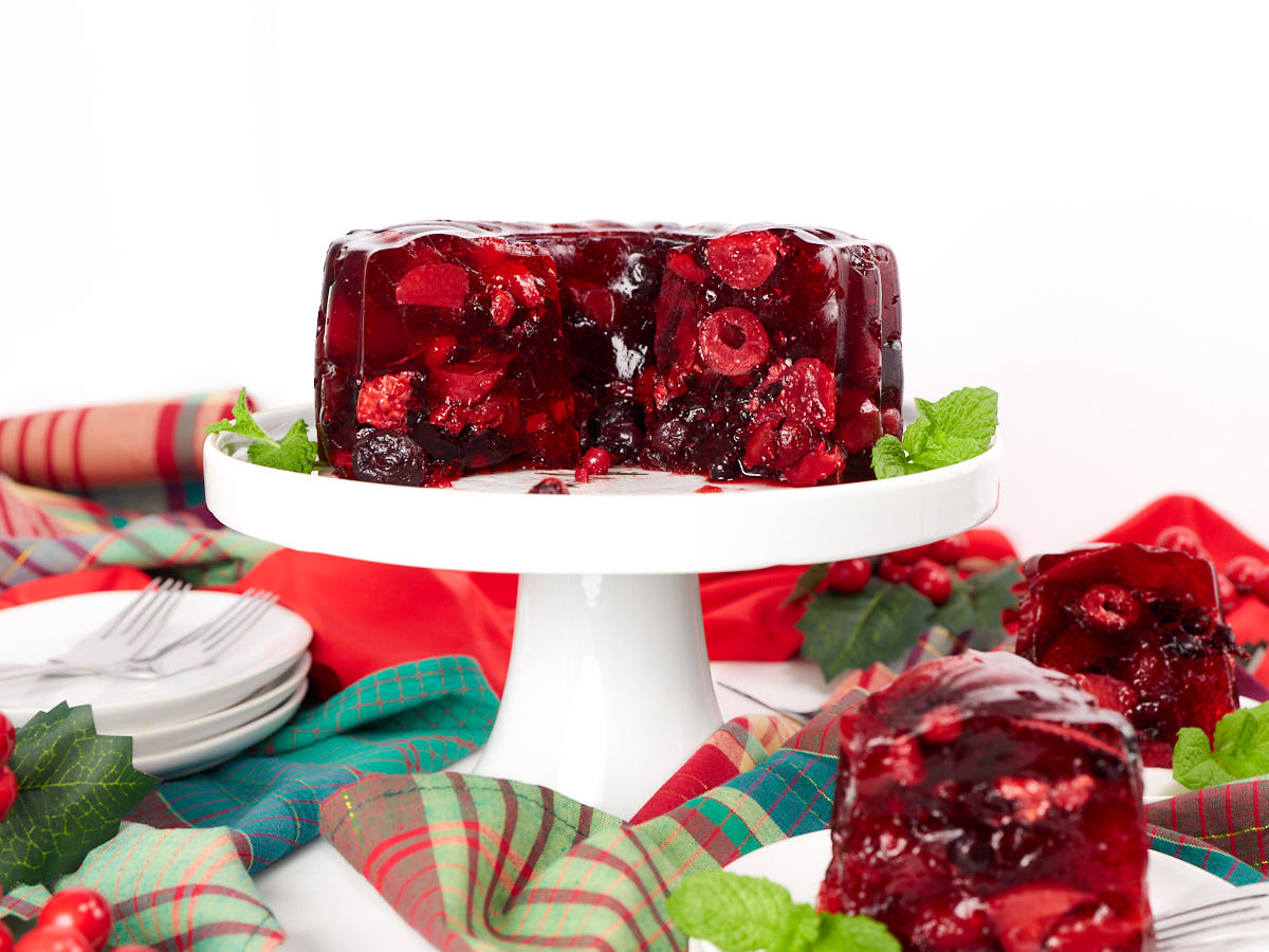 Black cherry salad on stemmed cake dish.