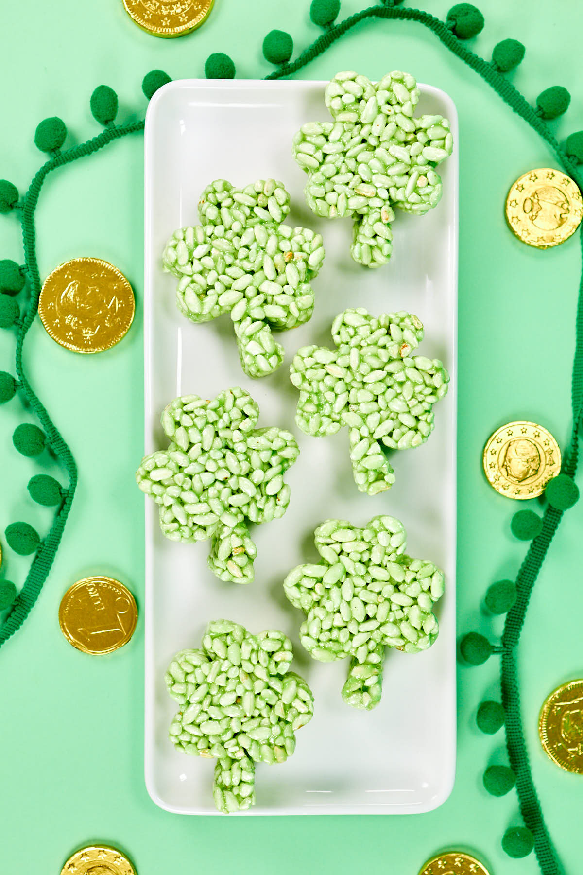 Lucky shamrock rice krispie treats on serving dish.