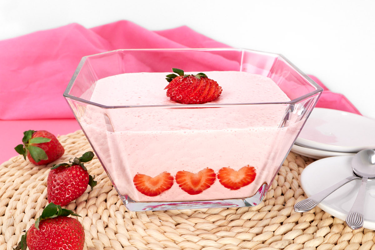 Strawberry flummery jelly whip decorated with strawberry hearts.