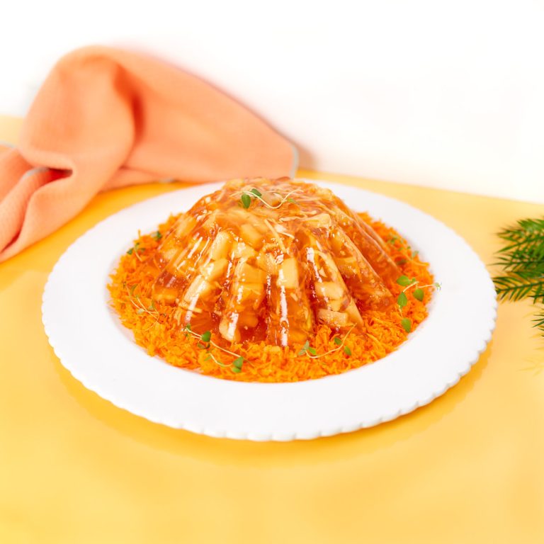 Sunshine jello carrot and pineapple congealed salad.